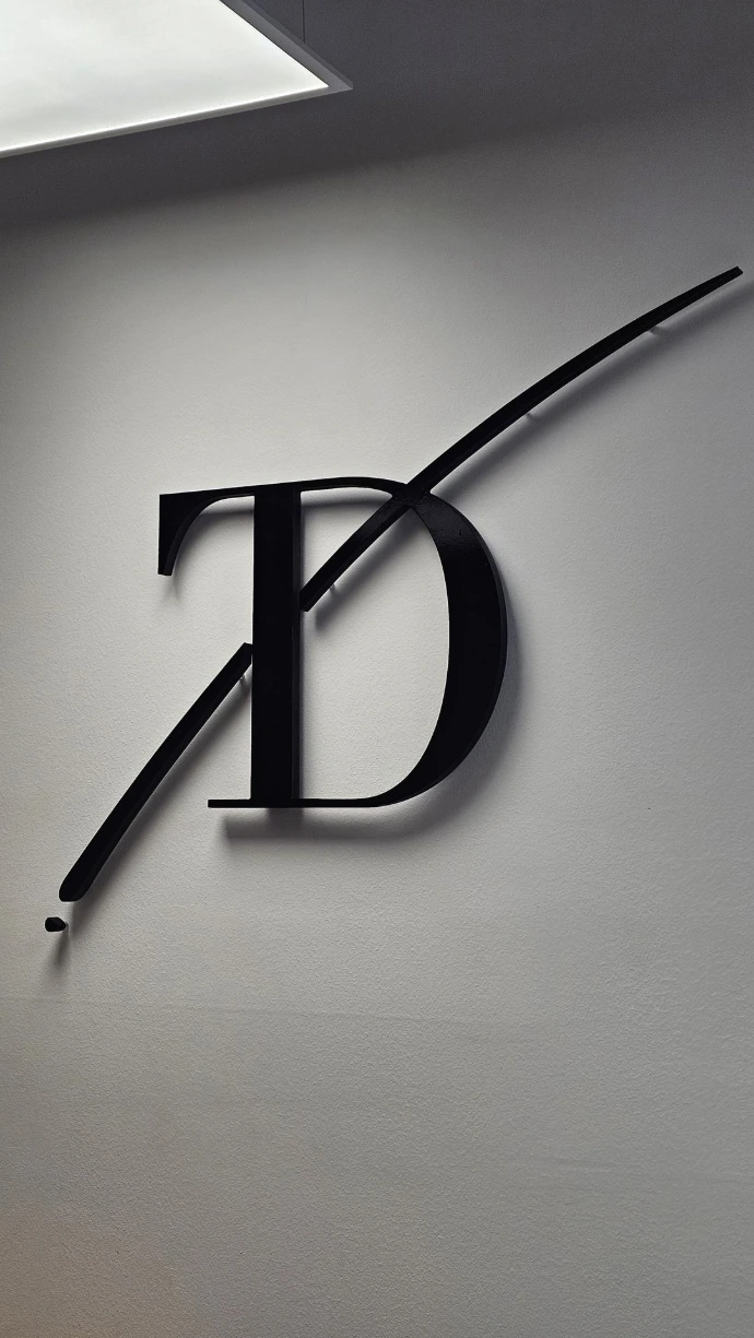 Black PVC letter mounted on wall with floating effect